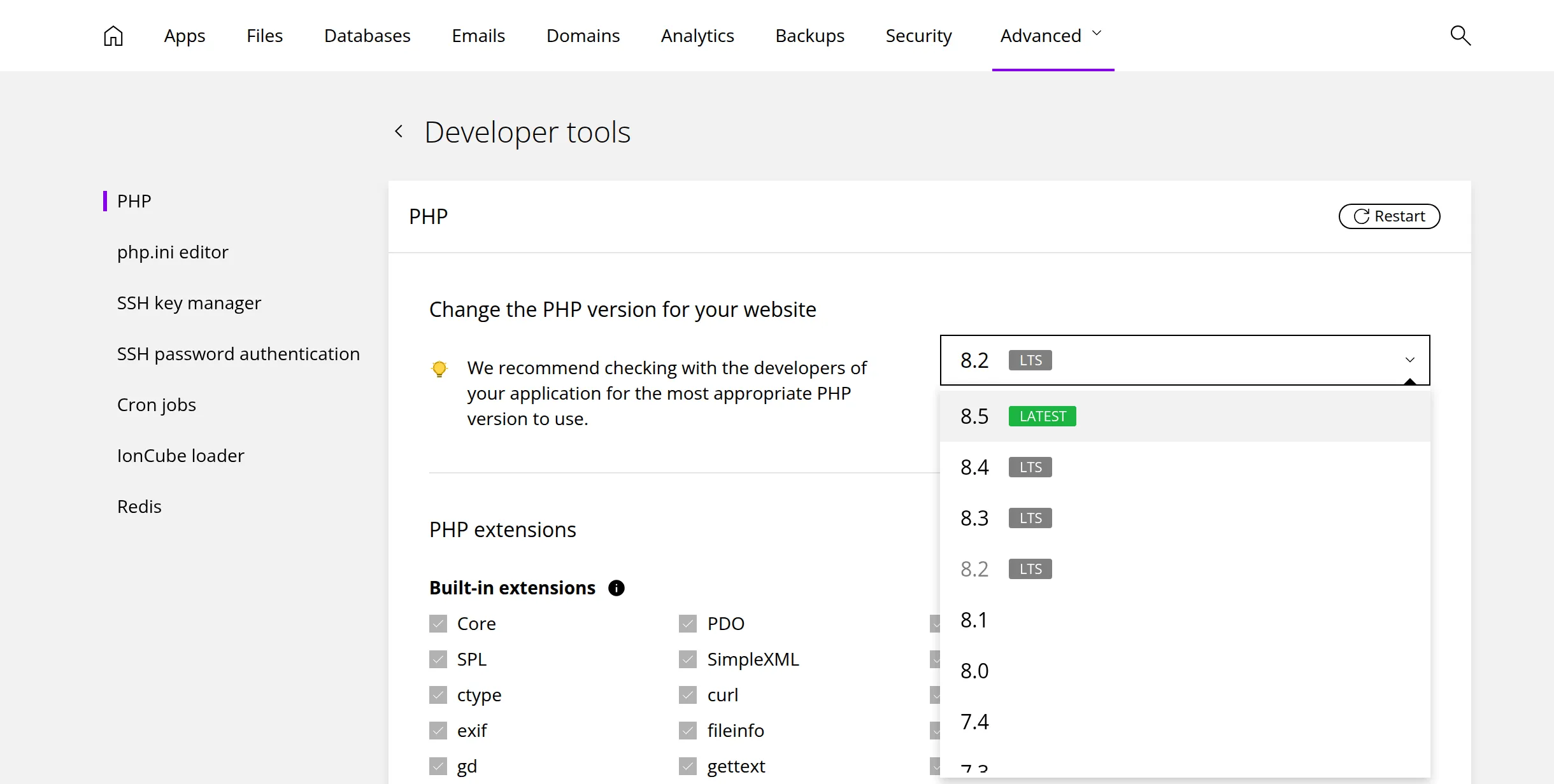 The PHP section of Developer tools with the version list open, showing 8.5 marked LATEST and 8.4, 8.3 and 8.2 marked LTS, followed by older versions. Marker 1 is beside the version list, marker 2 beside the Restart button, marker 3 beside the newest version, marker 4 beside php.ini editor in the section list and marker 5 beside Built-in extensions.